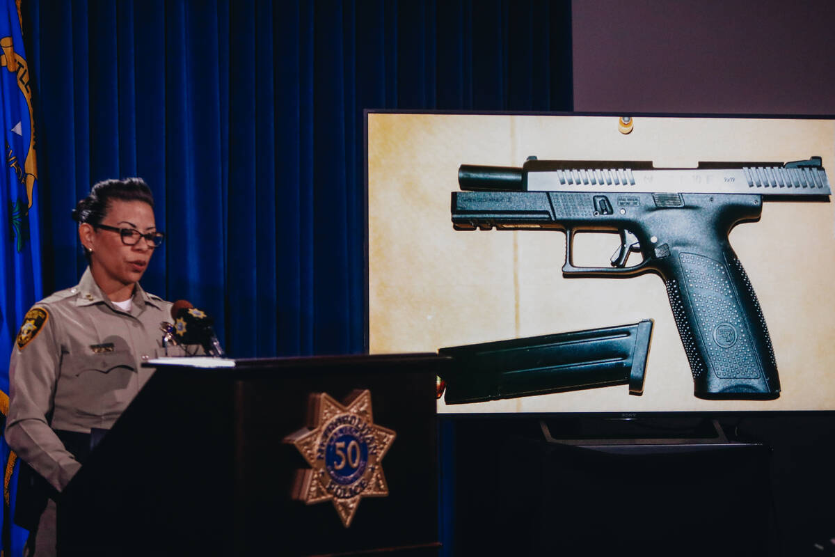 Assistant Sheriff Yasina Yatomi shows the gun that Matthew Glunt allegedly used to shoot at two ...