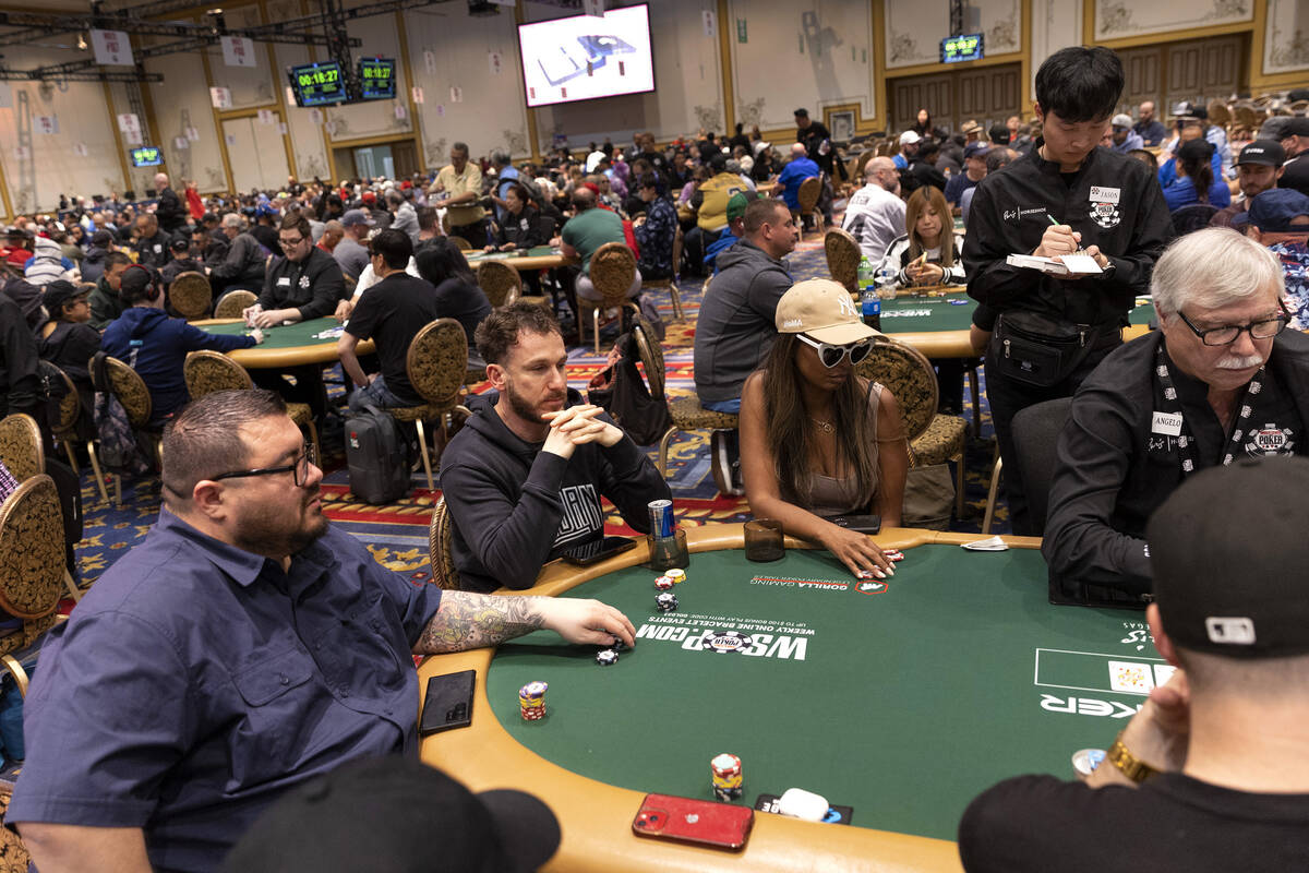 Players watch the dealer during the first day of the World Series of Poker at Horseshoe Las Veg ...