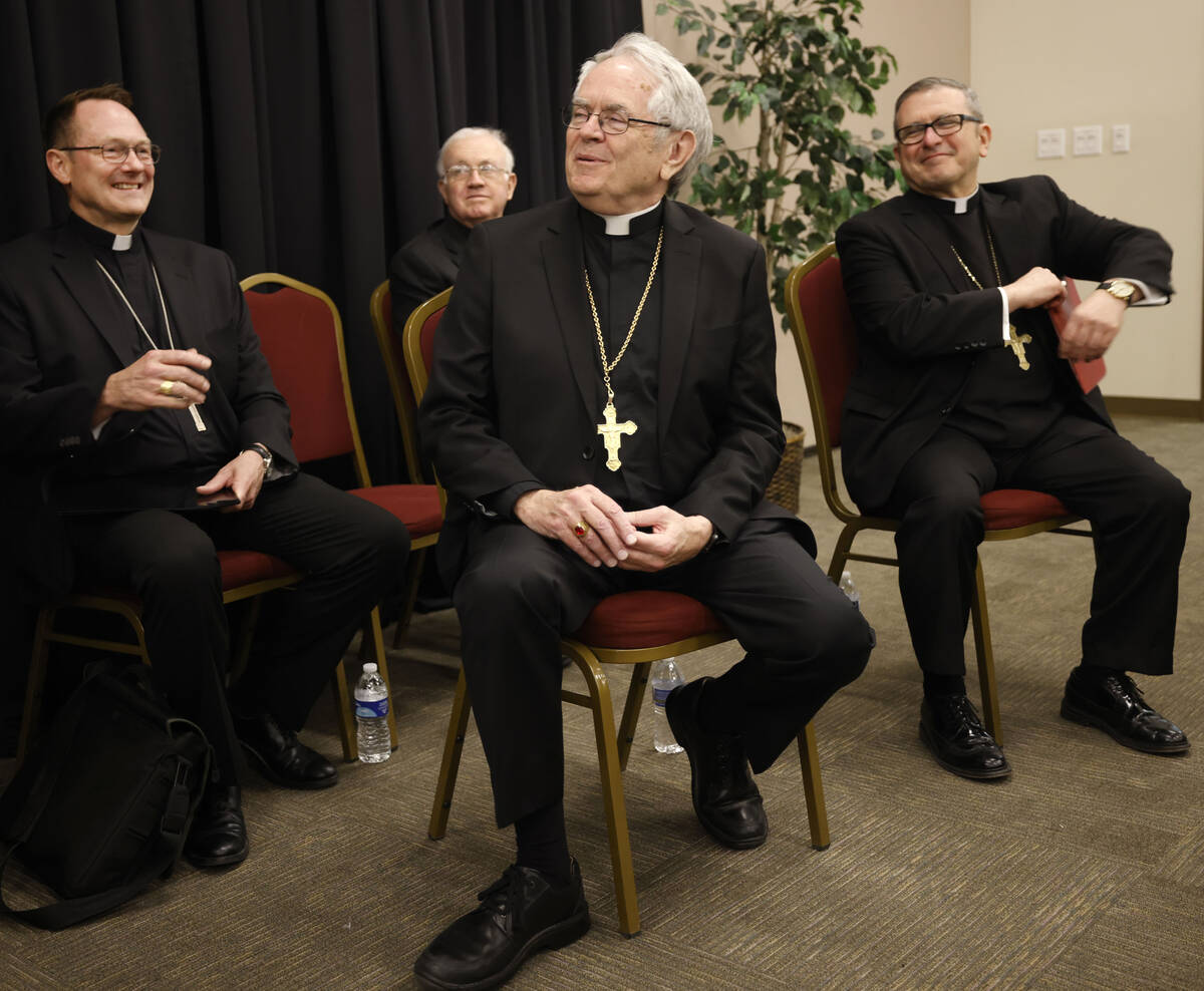Archbishop of Las Vegas George Leo Thomas, center, smiles during a news conference at the Archd ...