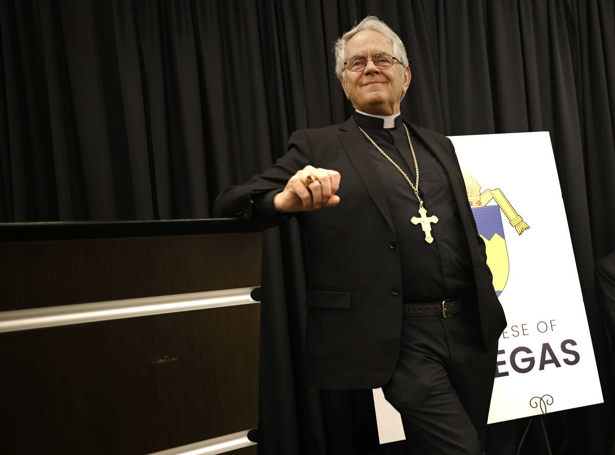 Archbishop of Las Vegas George Leo Thomas, takes questions from the media members during a news ...