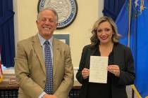 Gov. Joe Lombardo and Senate Majority Leader Nicole Cannizzaro pose for a photo after Lombardo ...