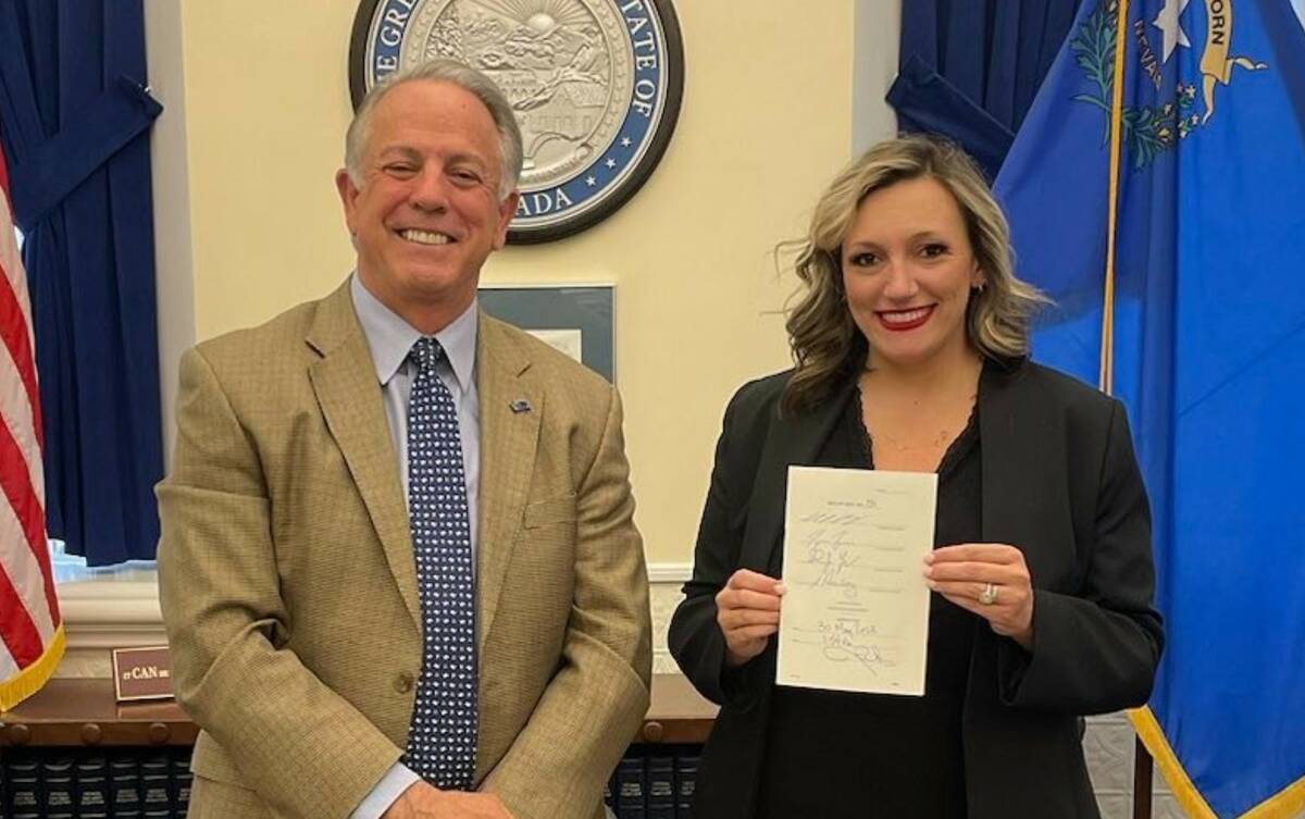 Gov. Joe Lombardo and Senate Majority Leader Nicole Cannizzaro pose for a photo after Lombardo ...