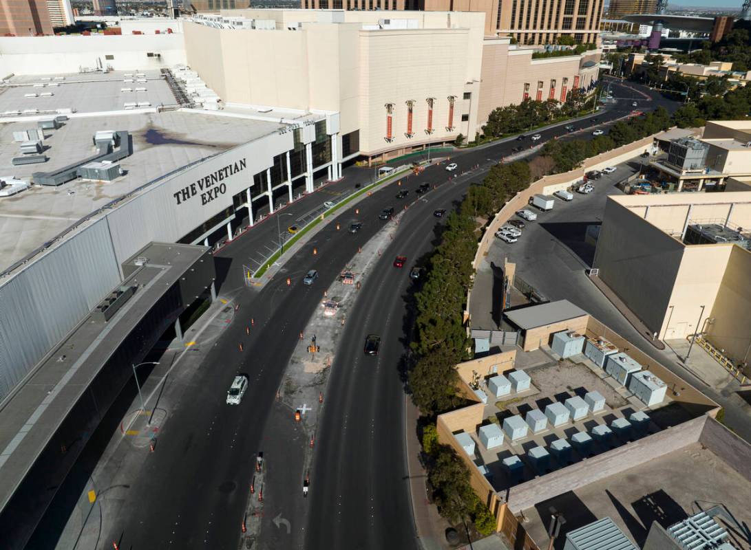 Traffic cones and road construction equipment are placed on Sands Avenue near the Venetian Expo ...