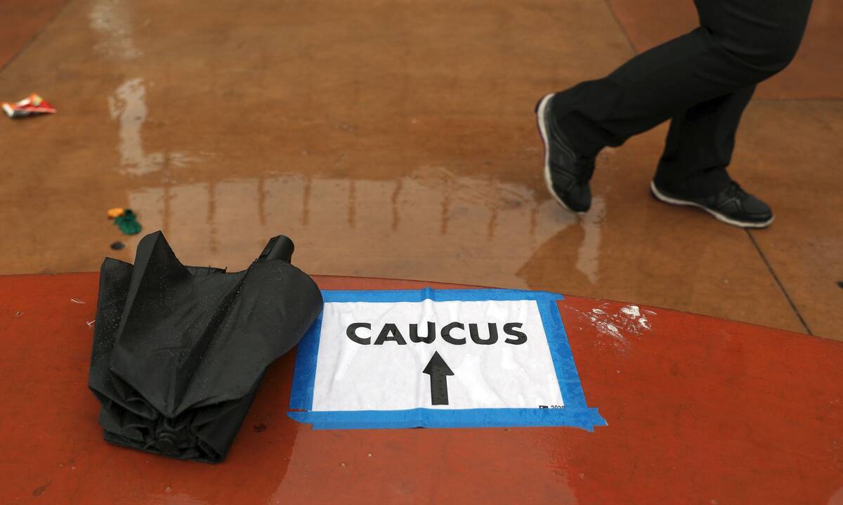 Voters arrive to register for the caucus at the East Las Vegas Community Center in February 202 ...