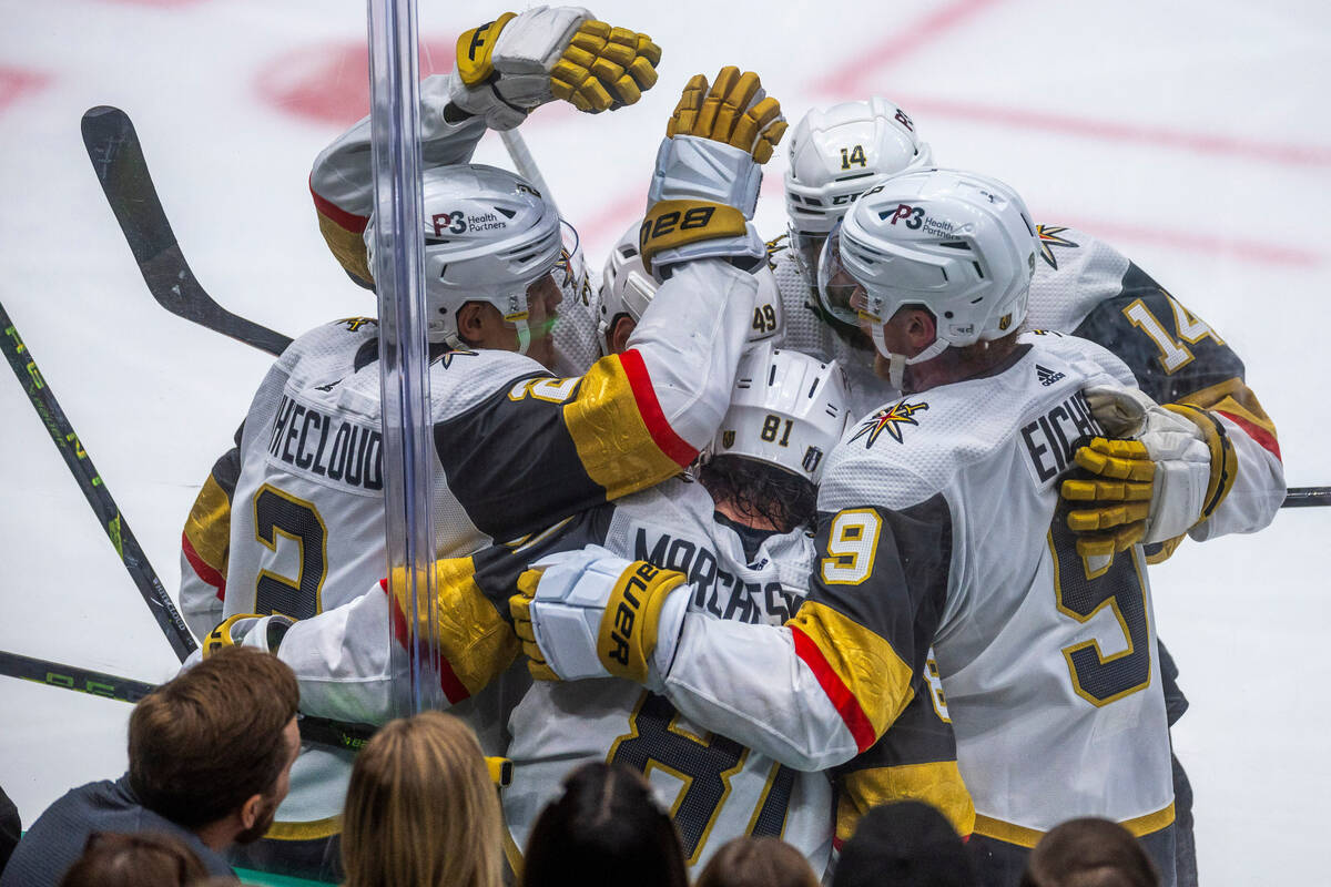 Golden Knights players celebrate the fourth goal against the Dallas Stars in the second period ...