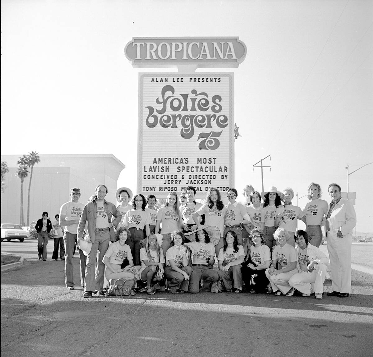 The cast of "Folies Bergere" pose under the marquee of the Tropicana hotel-casino Oct ...