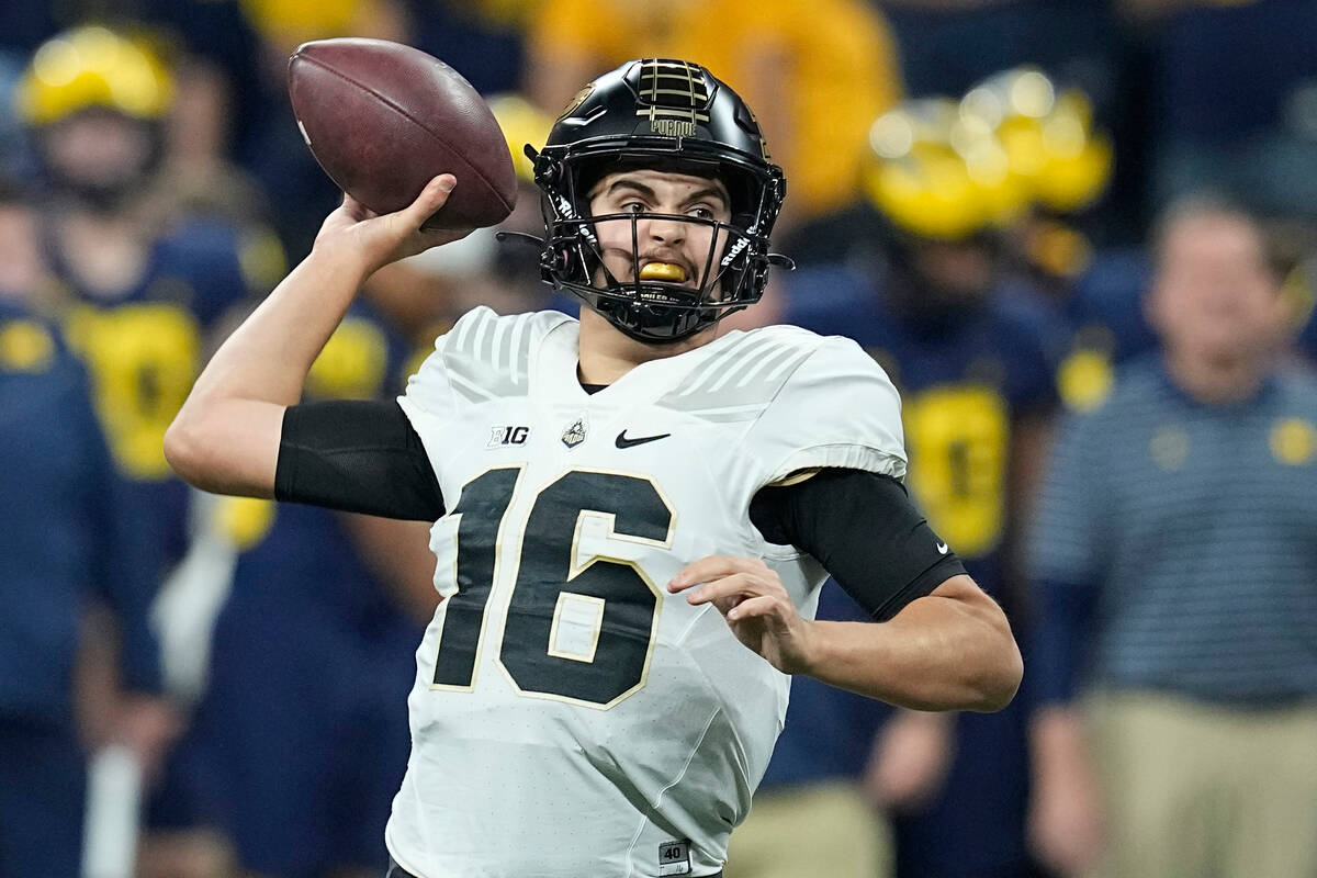 FILE - Purdue quarterback Aidan O'Connell throws during the first half of the Big Ten champions ...