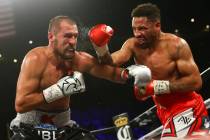 Sergey Kovalev, left, takes a hit from Andre Ward during their light heavyweight championship f ...
