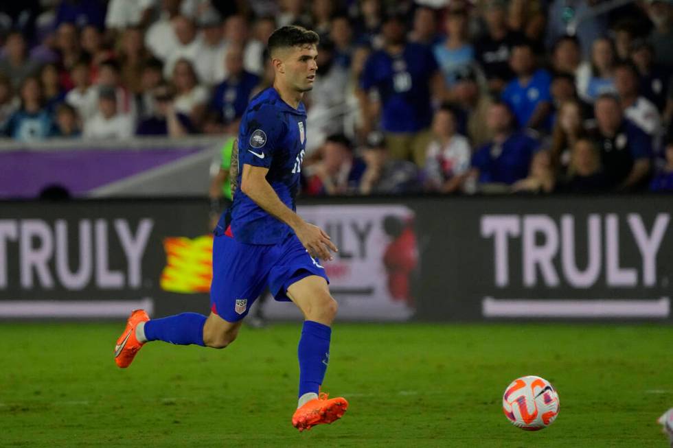 United States forward Christian Pulisic (10) moves the ball against the El Salvador during the ...