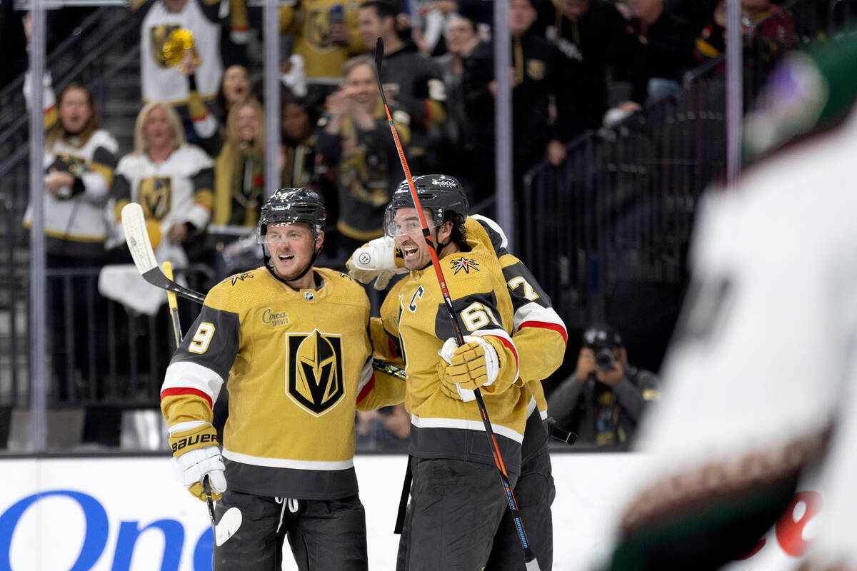 Golden Knights center Jack Eichel (9) and right wing Mark Stone (61) celebrate after Stone scor ...