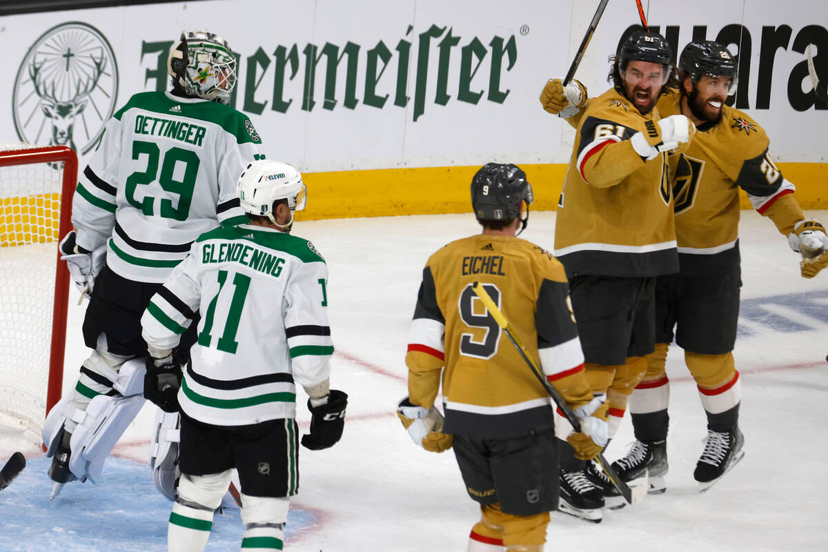 Golden Knights right wing Mark Stone (61) celebrates with his teammates Golden Knights center C ...
