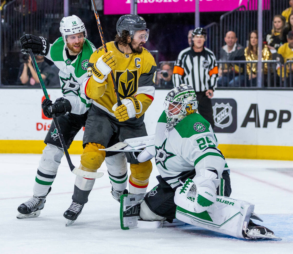 Golden Knights right wing Mark Stone (61) watches the puck miss the goal between Dallas Stars g ...