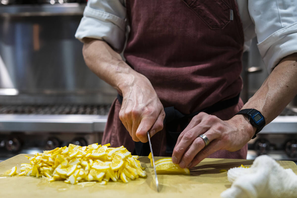 Sous Chef Chris Raleigh preps lemons at David Robins’ new restaurant, 1228 Main, on Wedn ...