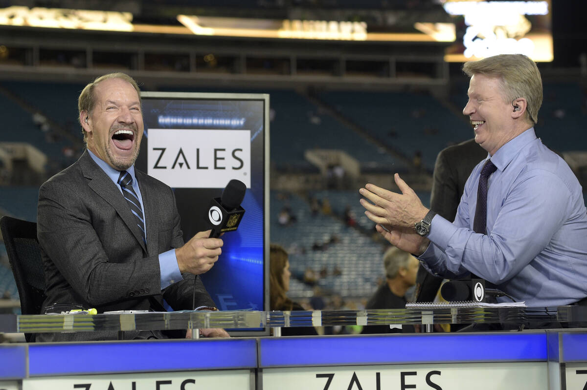 Thursday Night Football sportscasters Bill Cowher, left, and Phil Simms share a laugh during a ...