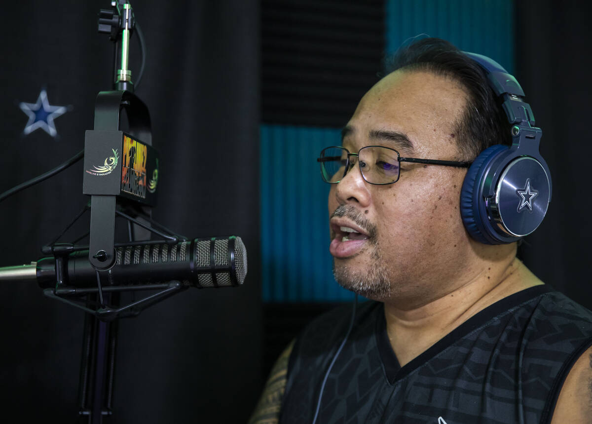 Paul Pu'ukani Sebala greets listeners on his radio station, Pipeline 2 Paradise Radio, in his h ...