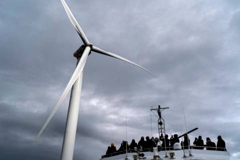 Guests tour one of the turbines of America's first offshore wind farm, owned by the Danish comp ...