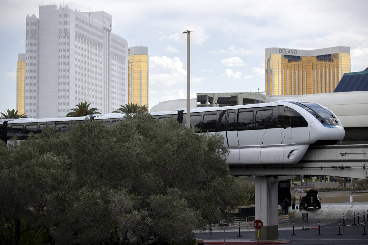 The Las Vegas Monorail travels near MGM Grand, with Tropicana in the background at left, on Wed ...