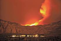 The Carpenter 1 Fire burns in the mountains behind the Red Rock Conservation Area visitor cente ...