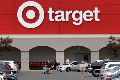 FILE - This May 15, 2020, file photo shows customers outside a Target store in Danvers, Mass. T ...