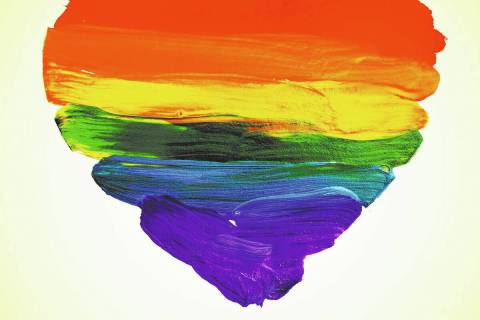 the word love and a rainbow heart painted on a beige background, with a retro effect