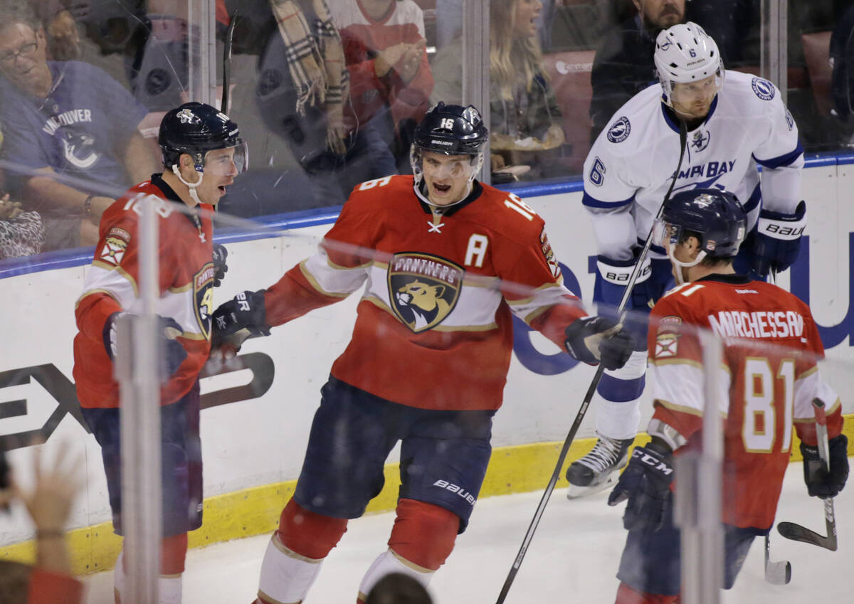 Florida Panthers right wing Reilly Smith, left, celebrates his tiebreaking goal with center Ale ...