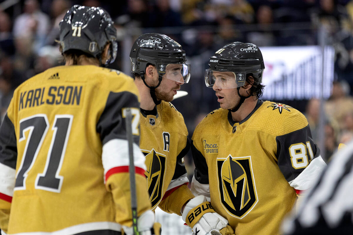 Golden Knights right wing Reilly Smith (19) and right wing Jonathan Marchessault (81) strategiz ...