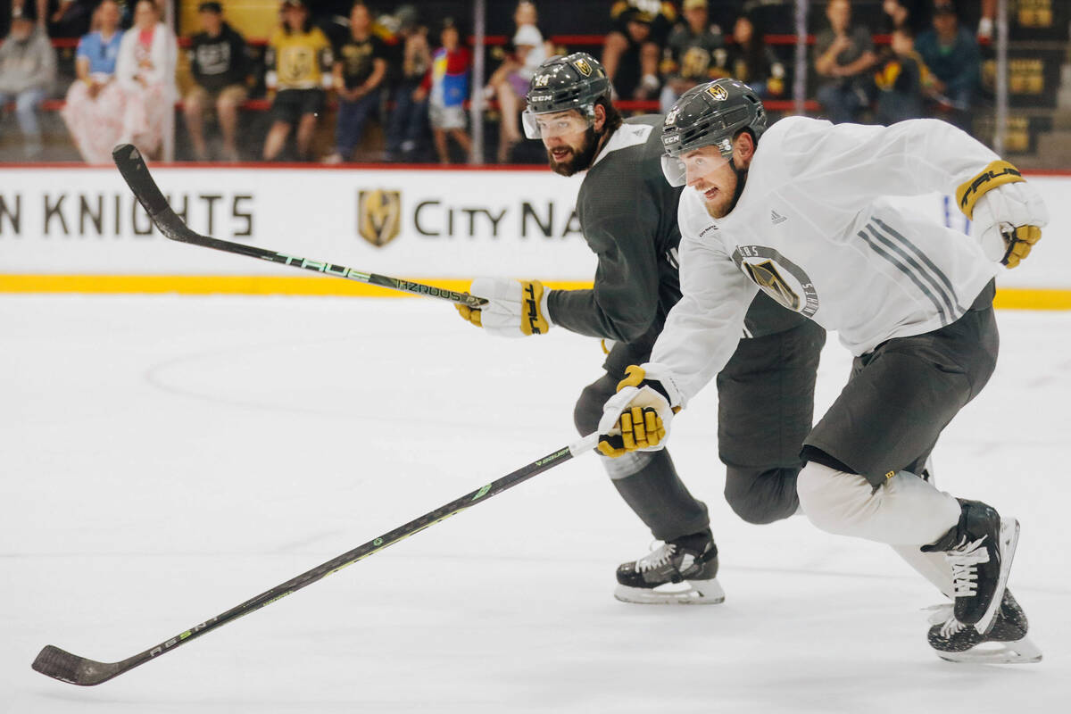 Golden Knights center Ivan Barbashev, front, chases after the puck along with defenseman Nicola ...