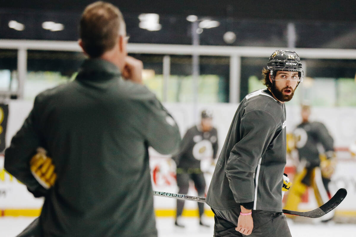 Golden Knights defenseman Nicolas Hague, right, listens to Knights assistant coach John Stevens ...