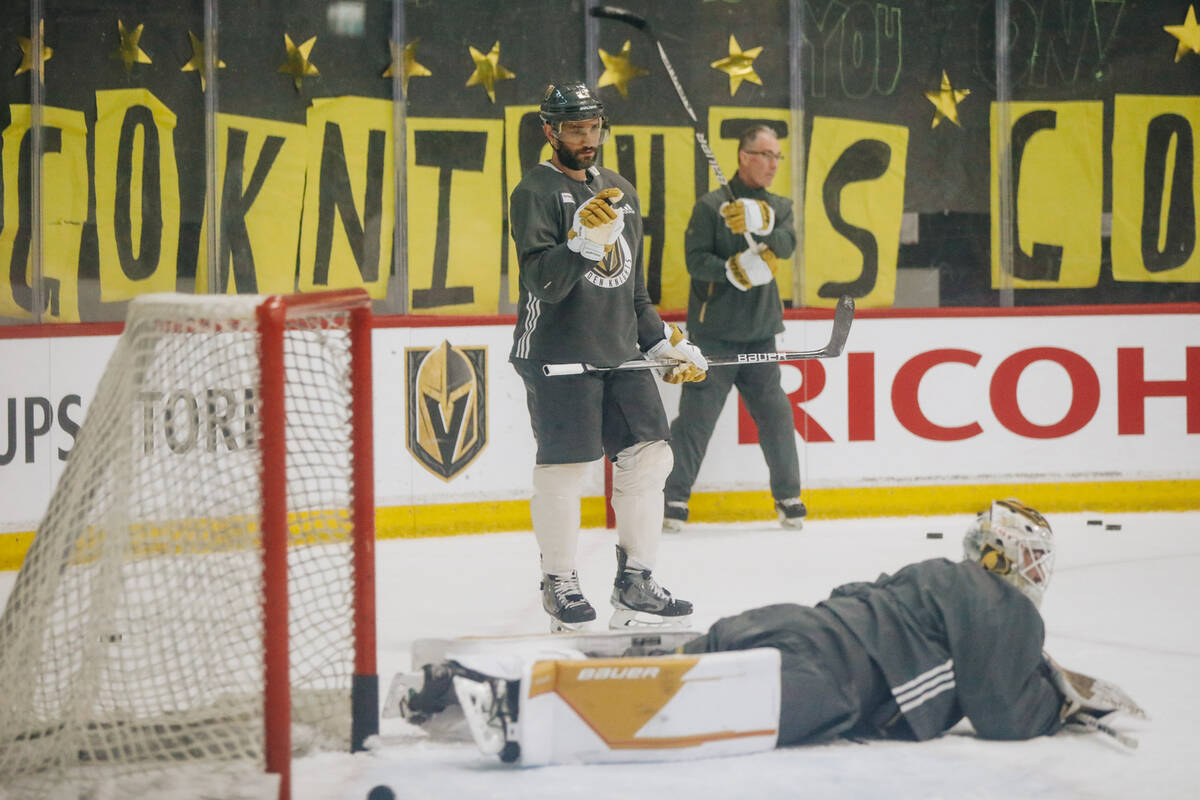 Golden Knights defenseman Alec Martinez waves his finger at a goalie who failed to keep a puck ...