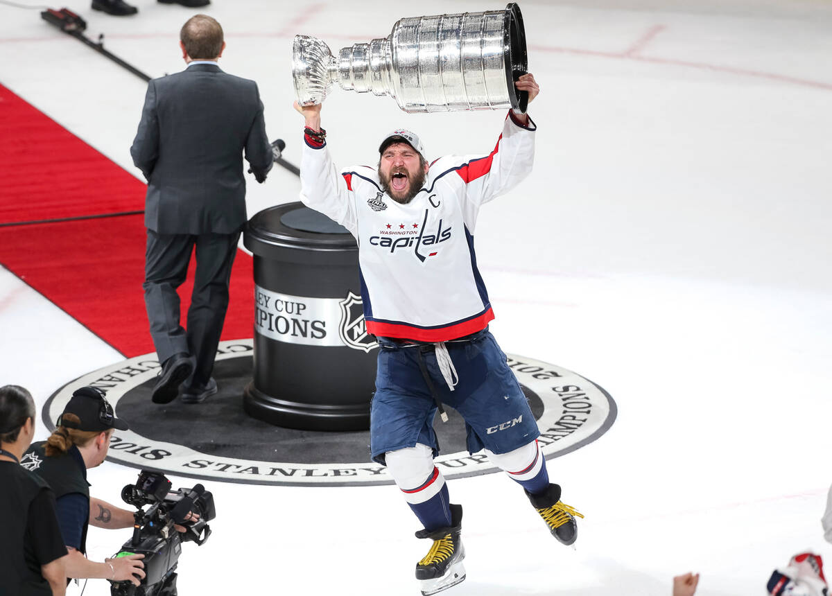 Washington Capitals left wing Alex Ovechkin (8) celebrates with the Stanley Cup Final after def ...