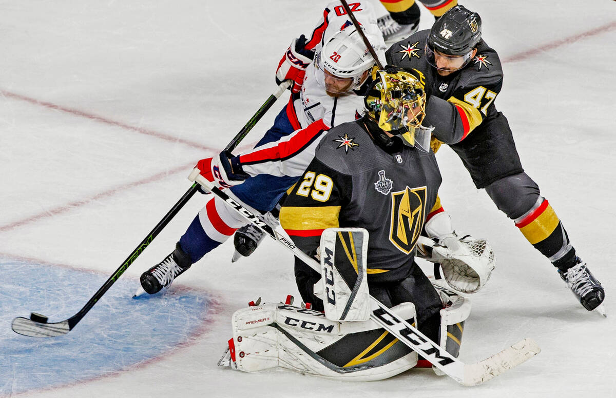 Capitals center Lars Eller (20) scores a third-period goal past Golden Knights defenseman Luca ...