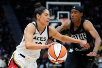 Las Vegas Aces guard Kelsey Plum (10) drives against Seattle Storm guard Yvonne Turner (22) dur ...