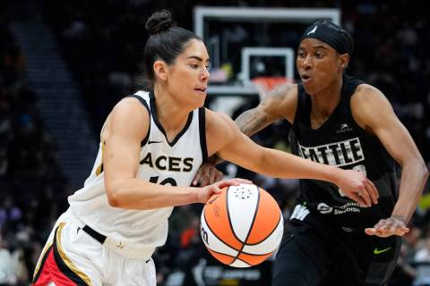 Las Vegas Aces guard Kelsey Plum (10) drives against Seattle Storm guard Yvonne Turner (22) dur ...