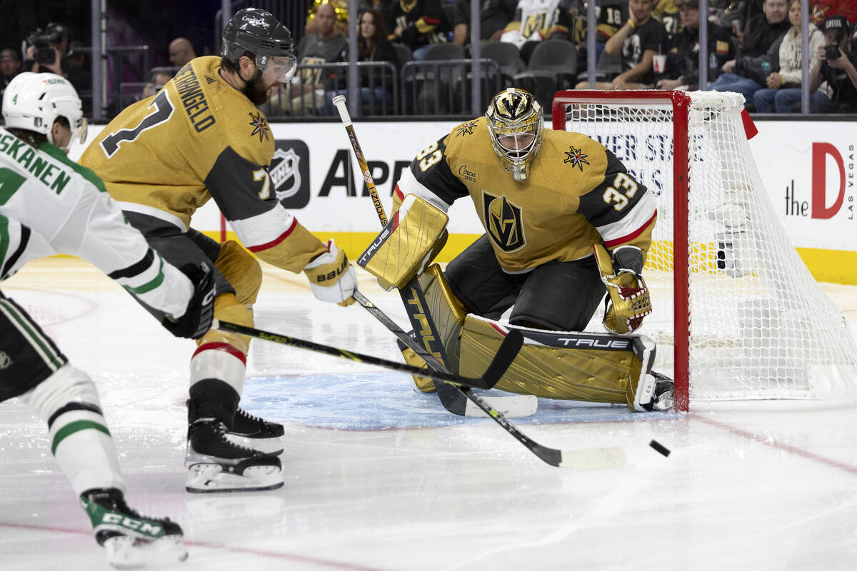 Golden Knights defenseman Alex Pietrangelo (7) blocks the puck before it reaches goaltender Adi ...