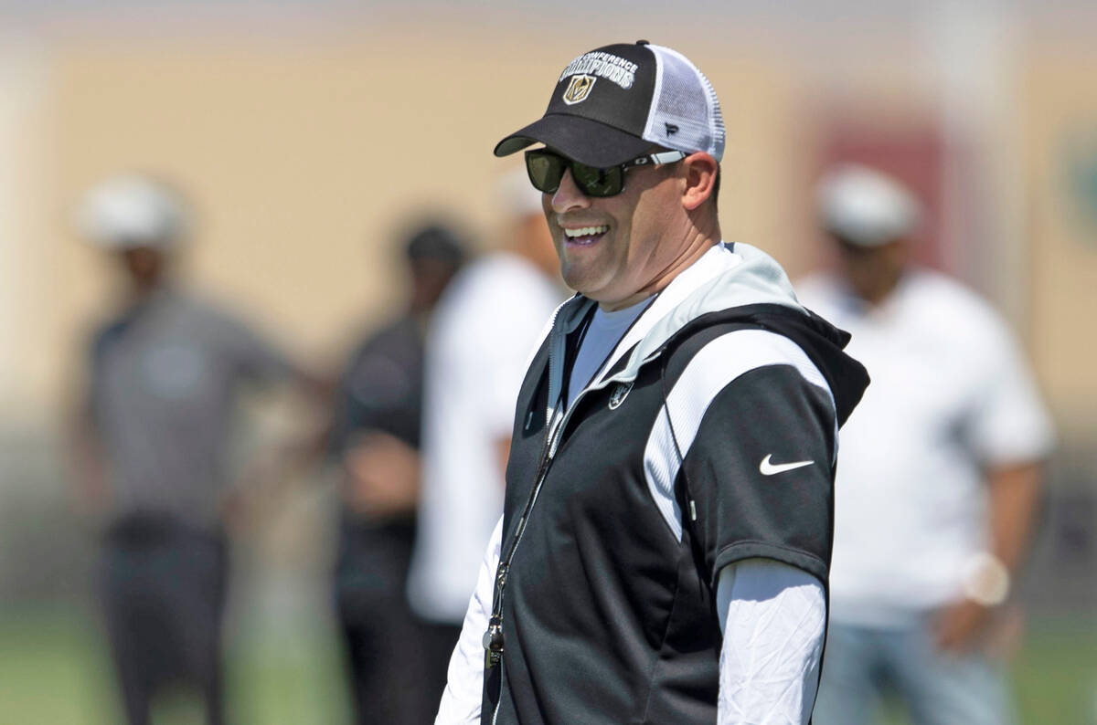 Raiders head coach Josh McDaniels reacts as he watches the team workout during an organized tea ...