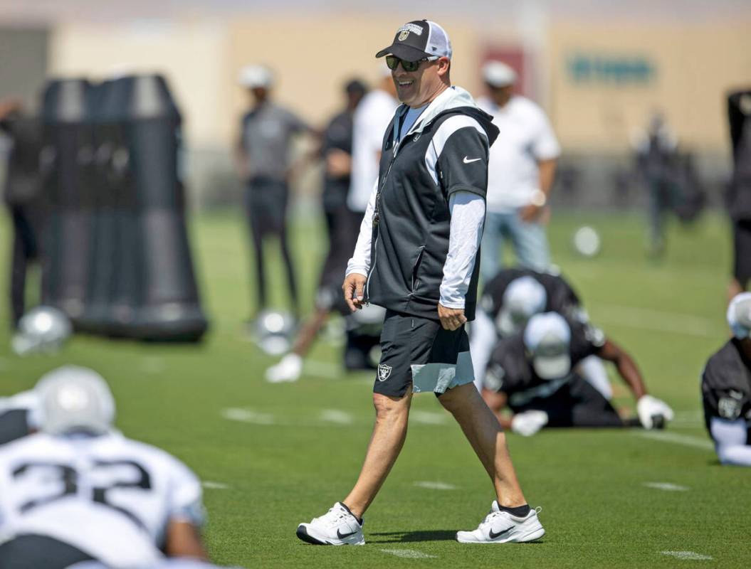 Raiders head coach Josh McDaniels reacts as he watches the team workout during an organized tea ...