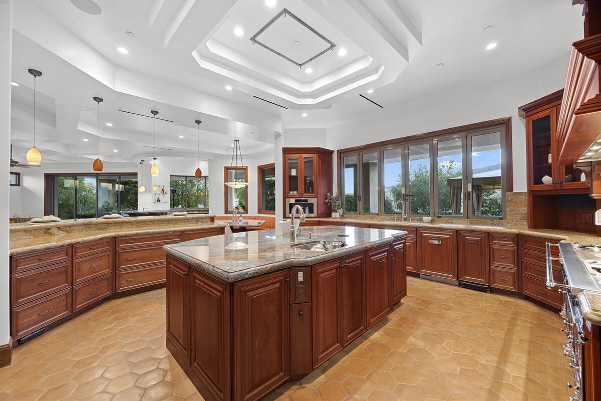 Nestled between the formal dining and the great room is the stylish, European-inspired chef’s ...
