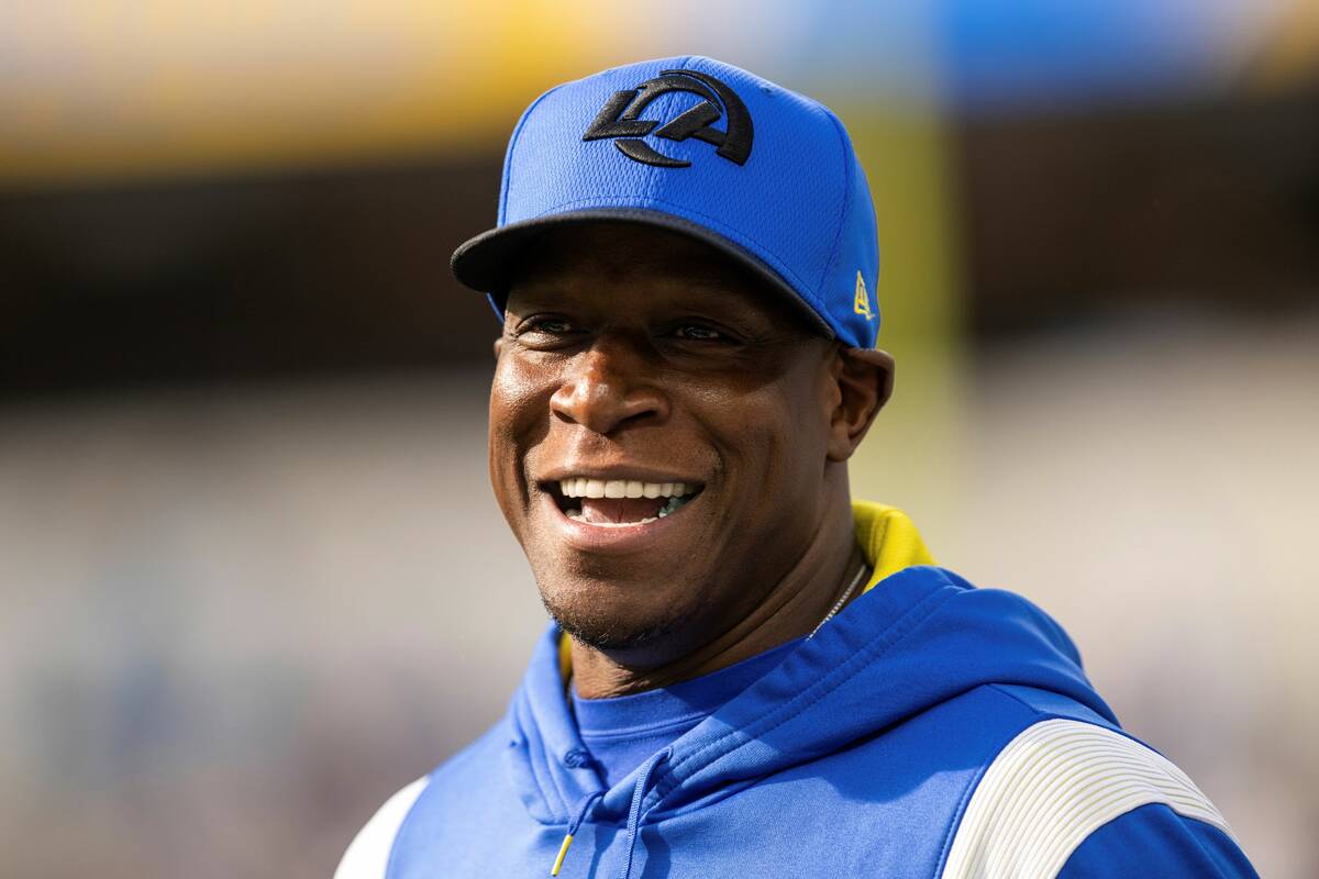 Los Angeles Rams defensive coordinator Raheem Morris smiles before an NFL football game against ...
