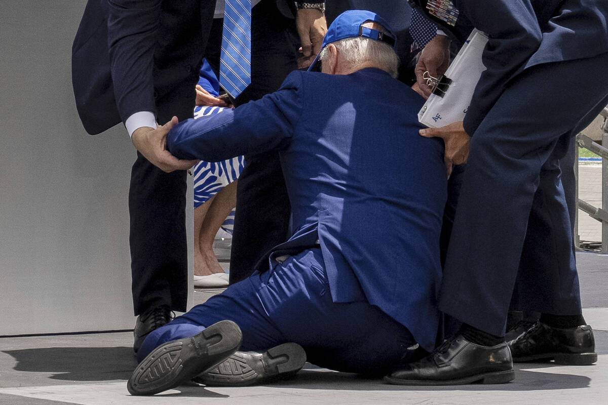 President Joe Biden falls on stage during the 2023 United States Air Force Academy Graduation C ...