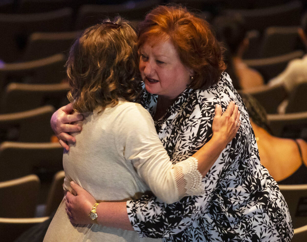 Friends and family embrace each other in mourning during the Celebration of Life for 17-year-ol ...