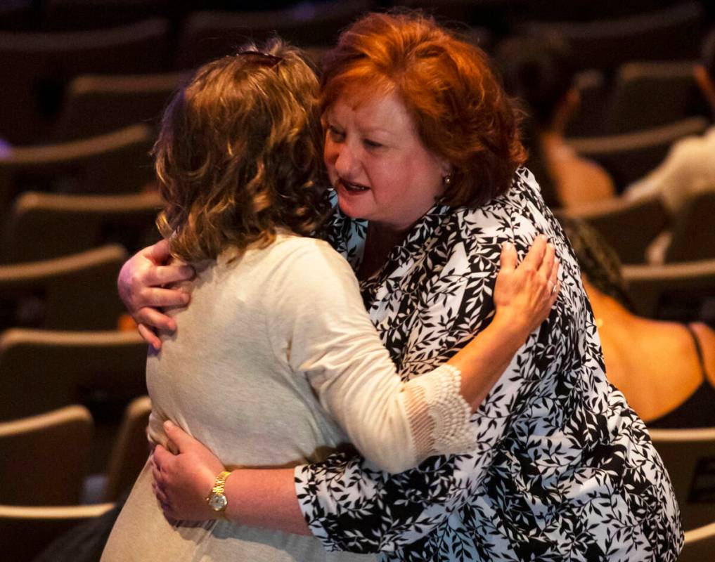 Friends and family embrace each other in mourning during the Celebration of Life for 17-year-ol ...