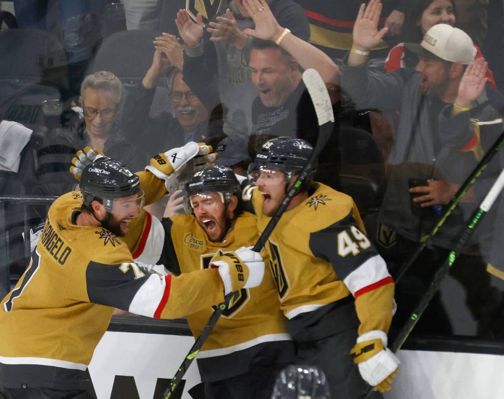 Golden Knights right wing Jonathan Marchessault (81), center, celebrates his teammates, Golden ...