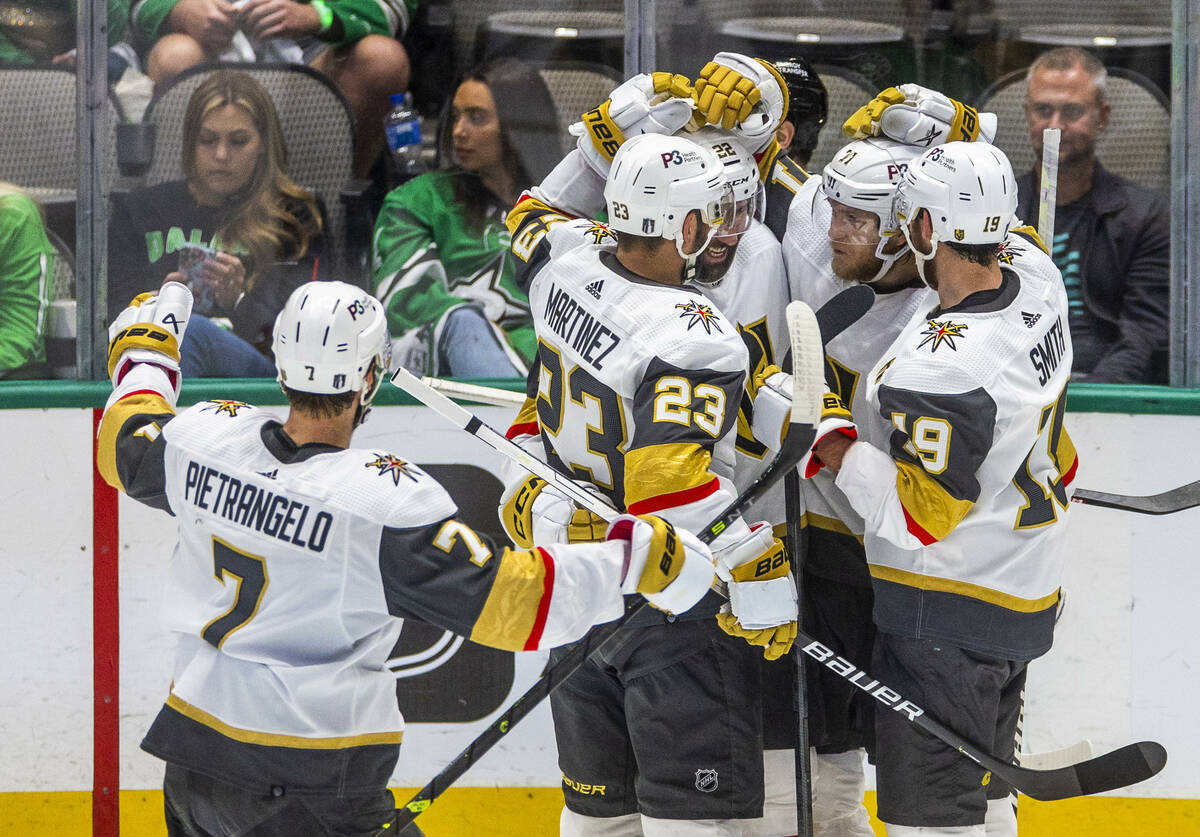 Golden Knights players celebrate a score against the Dallas Stars in the third period in Game 6 ...