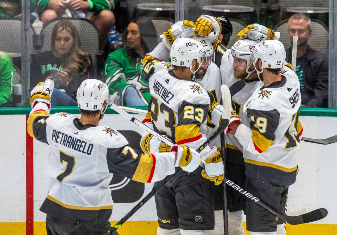 Golden Knights players celebrate a score against the Dallas Stars in the third period in Game 6 ...
