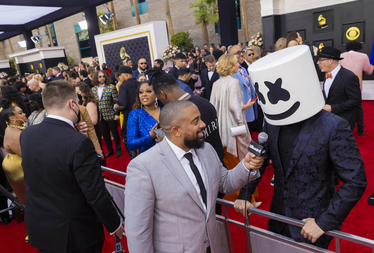 Marshmello, right, on the red carpet before the start of the 2022 Grammy Awards on Sunday, Apri ...