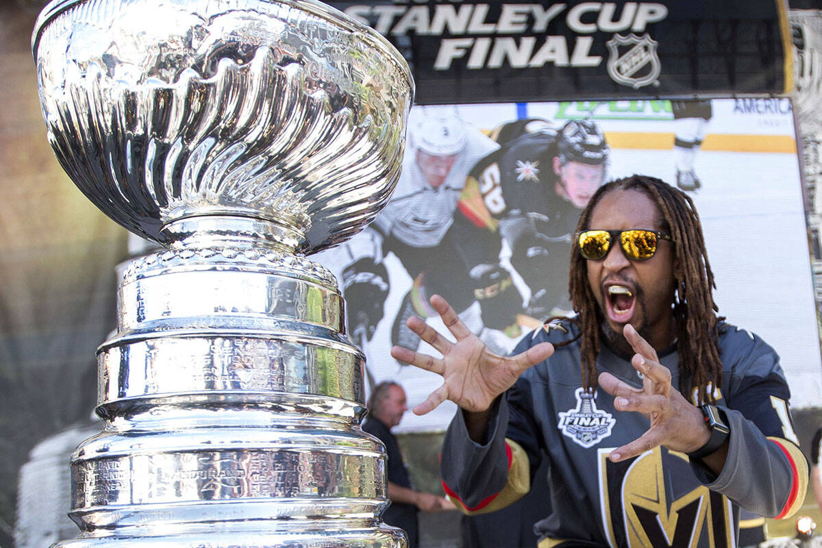 American rapper Lil Jon poses with the Stanley Cup before Game 1 of the NHL hockey Stanley Cup ...