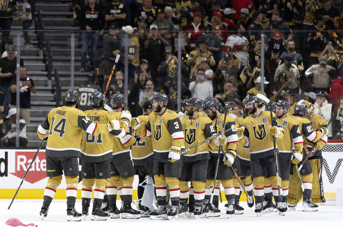 The Golden Knights gather after winning Game 1 of the NHL hockey Stanley Cup Finals against the ...