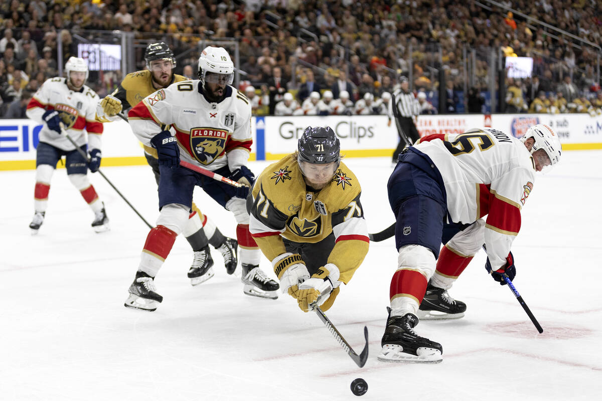 Golden Knights center William Karlsson (71) dives for the puck after facing off with Florida Pa ...