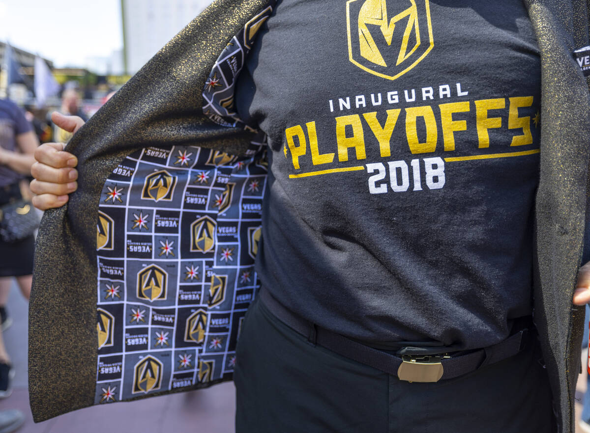 A Golden Knights fan sports a jacket lining with their logo outside before the start of Game 1 ...