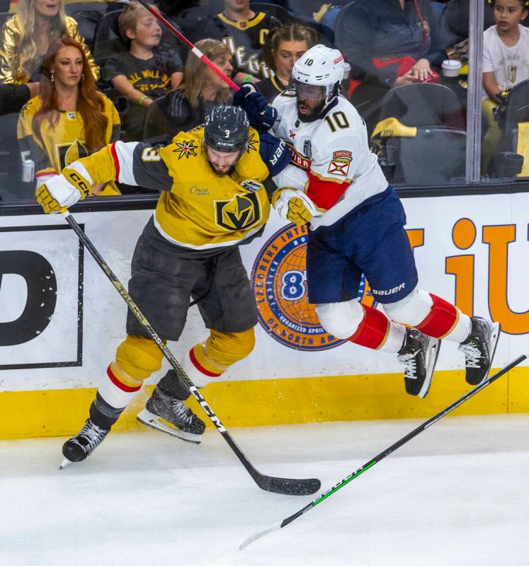 Golden Knights defenseman Brayden McNabb (3) and Florida Panthers left wing Anthony Duclair (10 ...